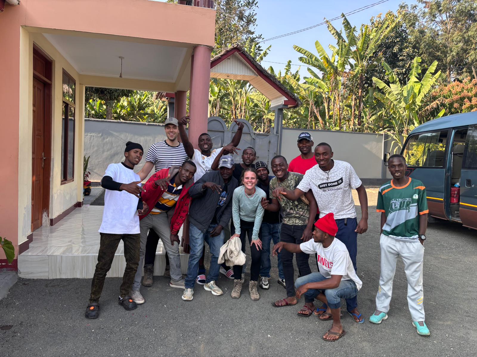 A group celebrating together outside a mountain lodge
