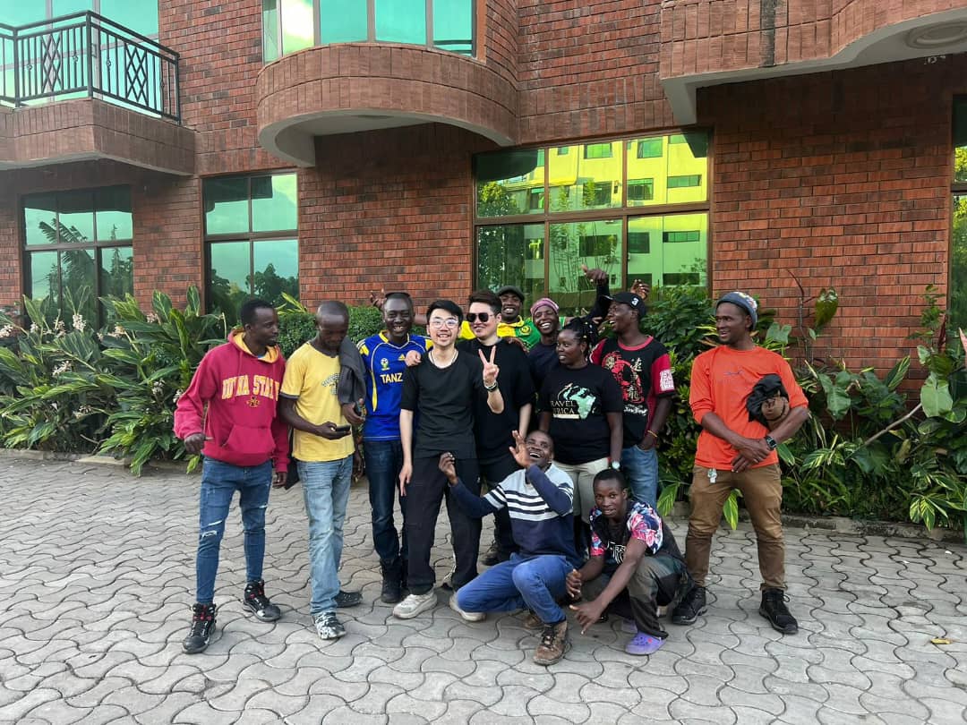 Climbers and mountain crew gathered outside a lodge